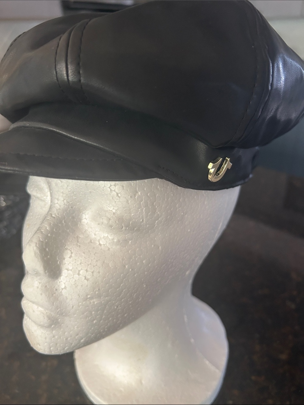 True Religion Black Faux Leather Conductor’s hat cap with gold Horseshoe Logo